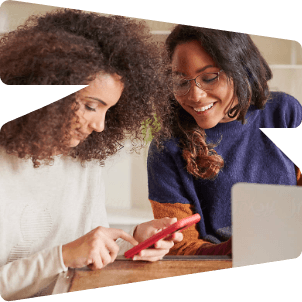 Two women looking at a phone