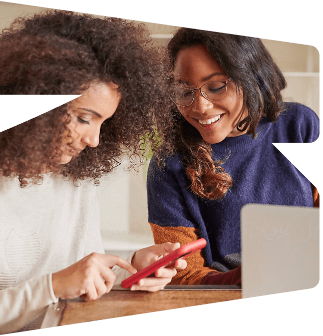 Two women looking at a phone