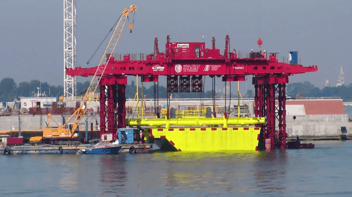 Screenshot of Espresso International video: Cranes erecting walls in Venice, Italy