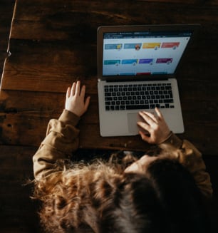 Bird's eye view of a female student using laptop