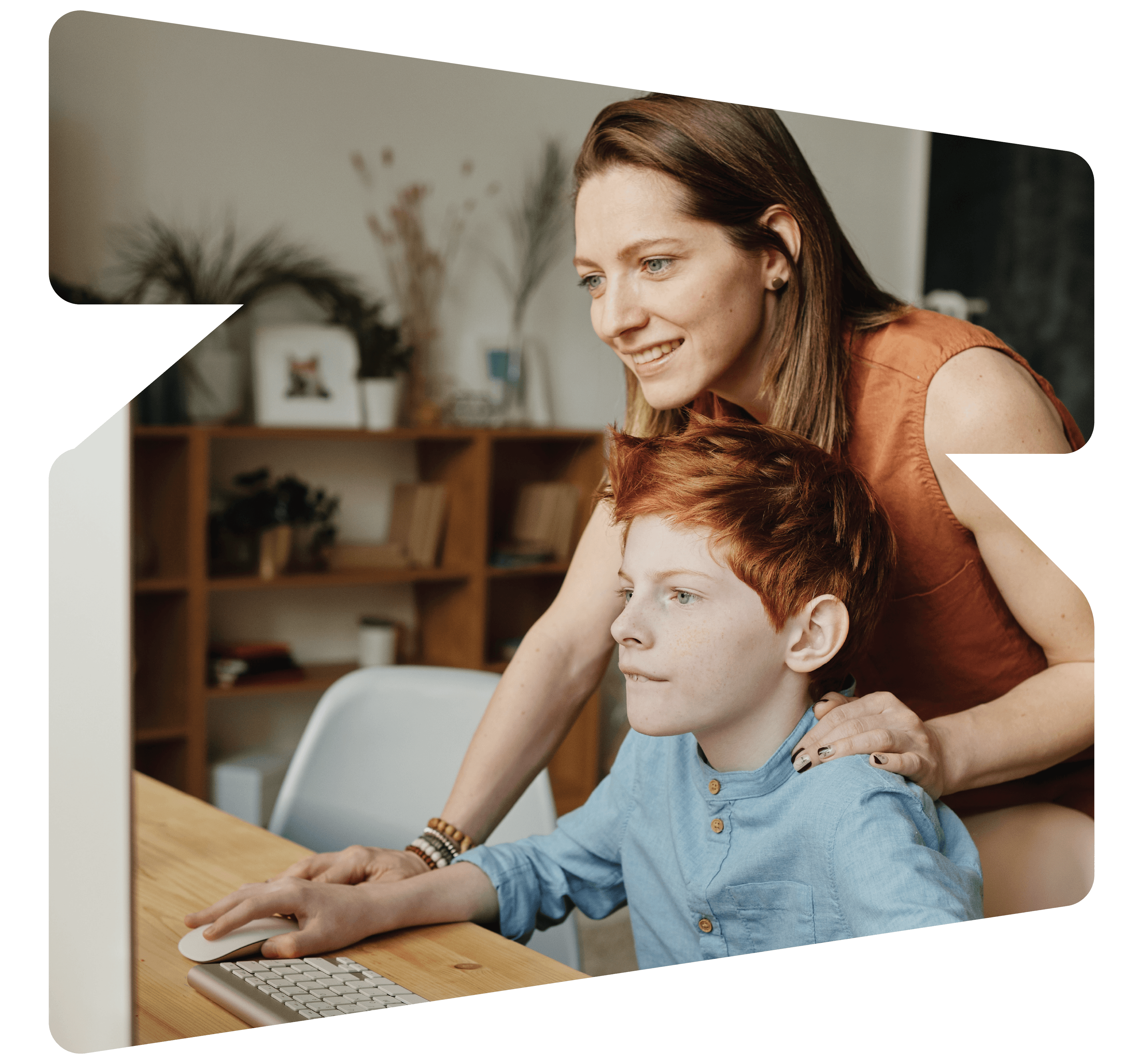 Mother standing over son looking at computer