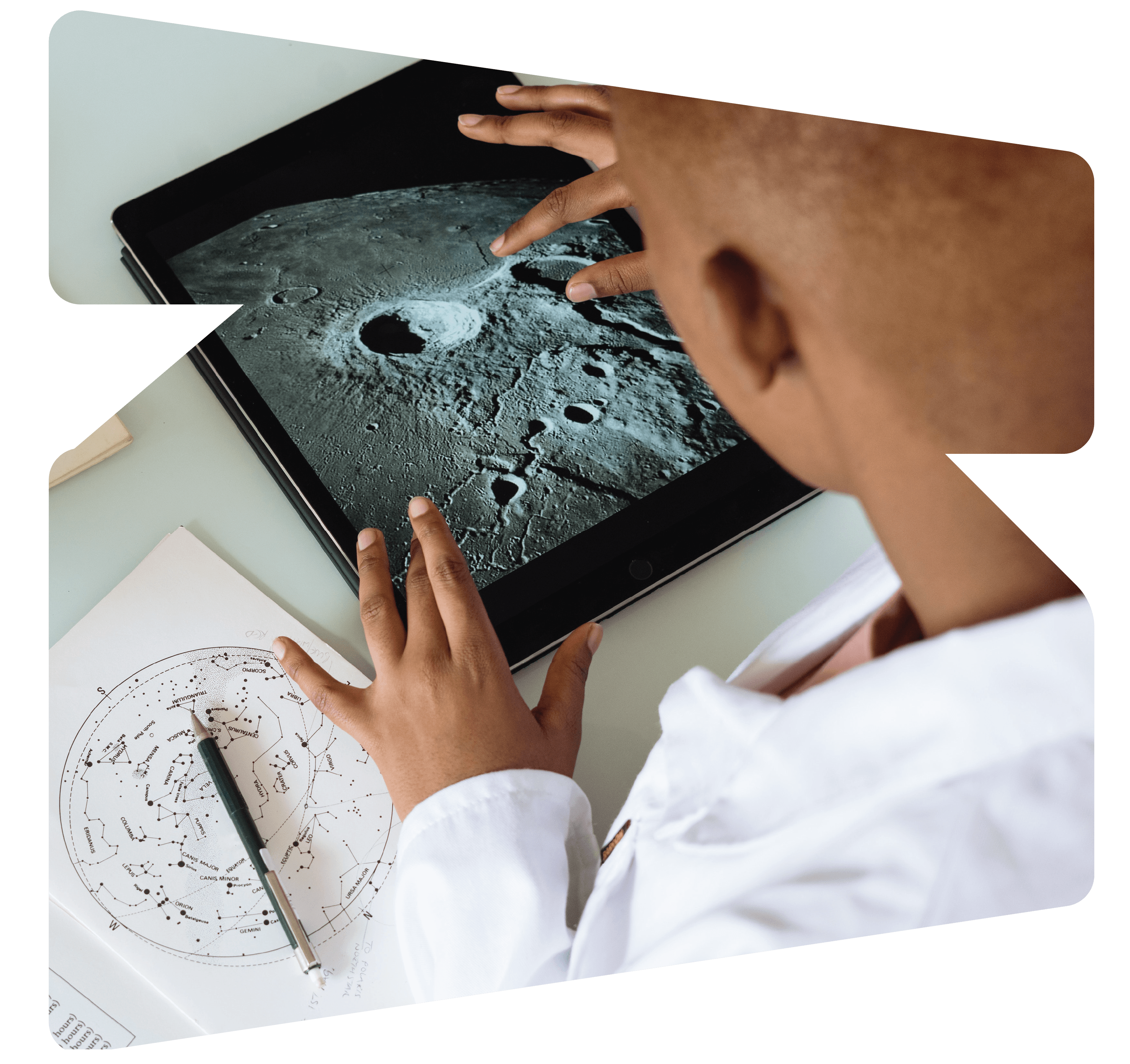 Student zooming in on an image of the moon on a tablet