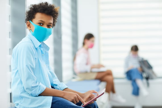 Students learning in school with facemasks